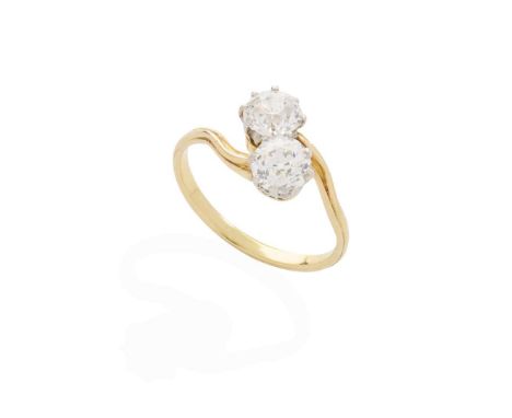  A diamond Moi-et-Toi ring  Claw-set with two old round-cut diamonds, weighing approximately 0.65cts and 0.62cts, ribbed deta