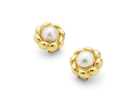  Garrard & Co: A pair of mabé-pearl earrings  Each collet-set with a mabé-pearl, the ribbed border with hammered finish, clip
