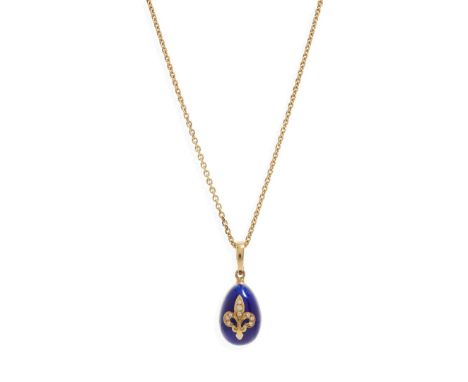  Fabergé: A limited edition enamel and diamond egg pendant  The blue enamelled egg with diamond fleur-de-lis detail, signed, 