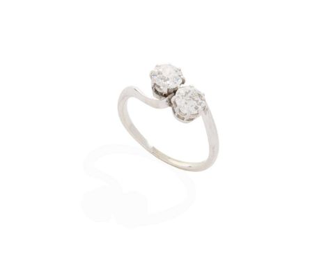  A diamond Moi-et-Toi ring  Claw-set with two old round-cut diamonds, weighing approximately 0.35cts each, plain band, unmark