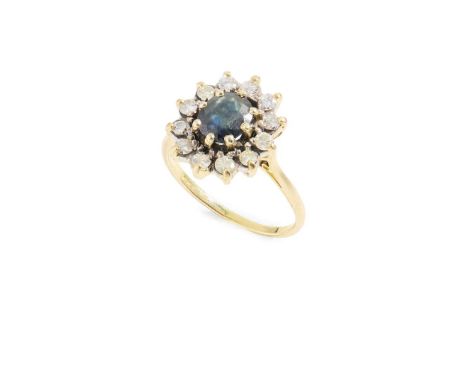  A sapphire and diamond cluster ring  Claw-set with an oval-cut sapphire, in a border of round brilliant-cut diamonds, plain 