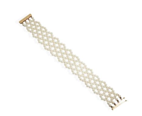  A woven pearl bracelet  Composed of multiple woven strands of seed pearls, the 9ct gold clasp with engine-turned detail, UK 
