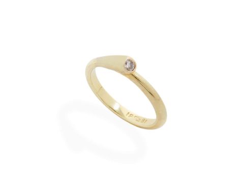  A diamond ring  Collet-set with a round brilliant-cut diamond, weighing approximately 0.05cts, plain band, stamped 18ct Ring