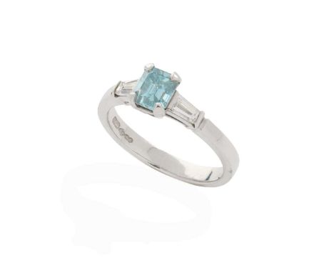  Brazen Studios: A platinum fancy blue and colourless diamond ring  Claw-set with a rectangular step-cut fancy blue diamond, 