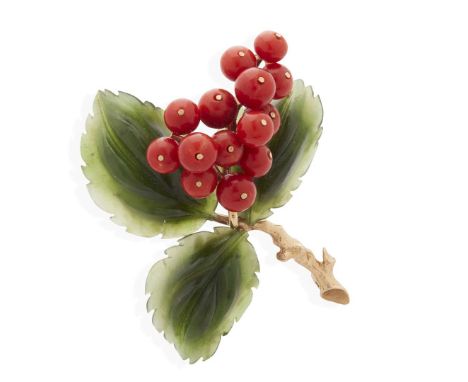  A coral and jade 'holly leaf' brooch  Composed of three carved nephrite jade leaves, set with fourteen coral beads, indistin