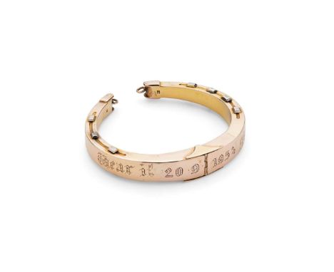  A 'Good Luck' horseshoe bangle  Of hinged design, modelled as a horseshoe engraved ‘Wear it 20.09.1953 Good Luck’, stamped 1