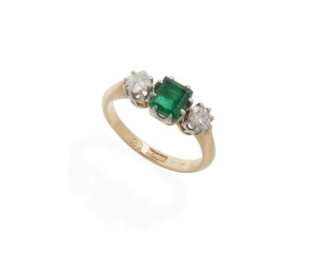  An emerald and diamond three-stone ring  Claw-set with a square step-cut emerald and two round brilliant-cut diamonds, plain