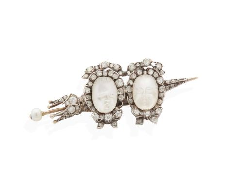  A late 19th century moonstone and diamond brooch, circa 1890  Set with two moonstones carved as baby's faces, in a border of