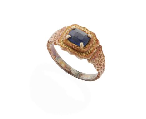  A late 19th century sapphire ring  Claw-set with a cushion-cut sapphire, in a shaped mount with engraved detail, unmarked Ri