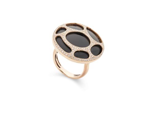  A diamond and onyx cocktail ring  The circular onyx panel in a stylised mount, pavé-set with small round brilliant-cut diamo