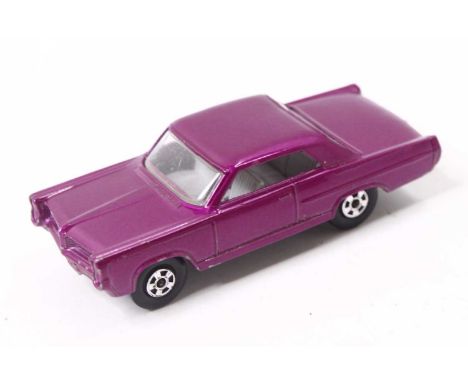 Matchbox Lesney Superfast No. 22 Pontiac GP Sports Coupe, light purple body, with a grey interior, narrow wheels, and a black