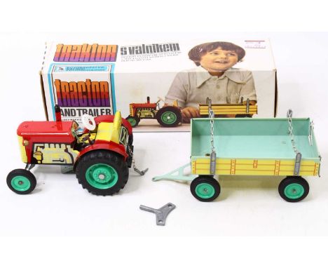 KOVOD tinplate and clockwork model of a tractor and trailer, housed in the original card box