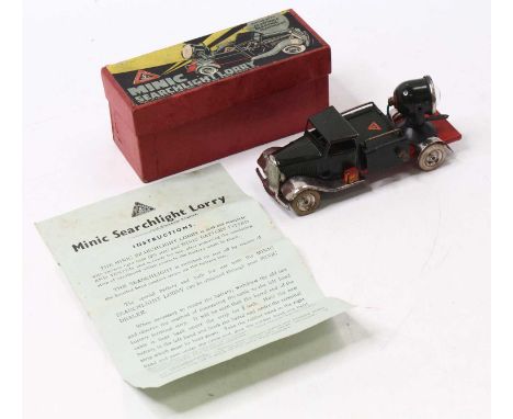 Triang Minic battery-operated searchlight lorry finished in military drab green with red chassis and white tyres, housed in a