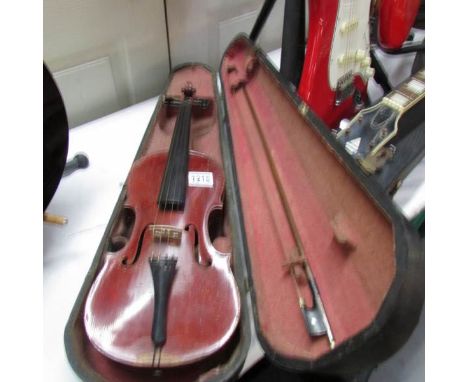 An old German copy of an Antonius Stradivarius violin with bow and in hard wood case.