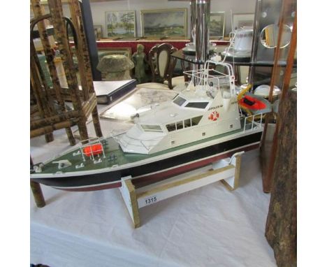 A model boat of a police launch complete with engine.