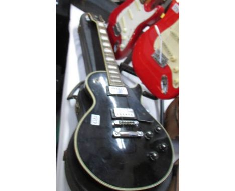 A 1970s Kay K-3 Les Paul style electric guitar with hard case.