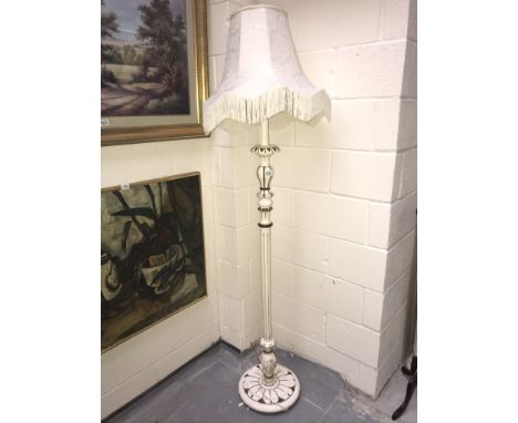 A white painted standard lamp