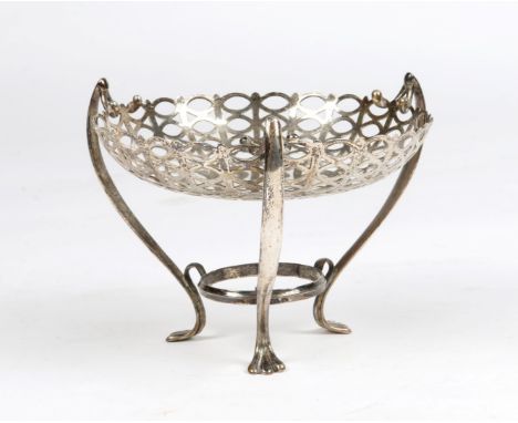 A SILVER SWEET MEAT DISH with pierced bowl and three whip lash handles and paw feet, 10cm high, Birmingham 1910, 4.9 troy oz