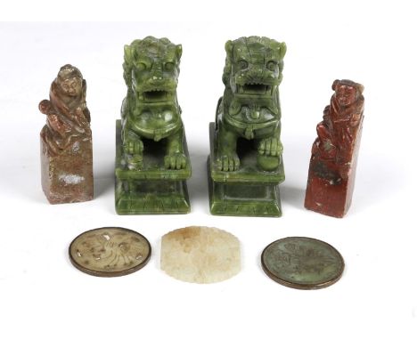 A PAIR OF CHINESE GREEN HARDSTONE FIGURES each in the form of a dog of foe, 11cm high; two soap stone figures of square secti