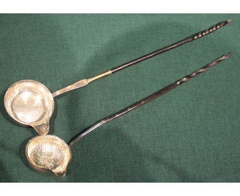 A TWISTED BONE HANDLED PUNCH LADLE, the bowl with inset silver coin and a similar punch ladle (2)