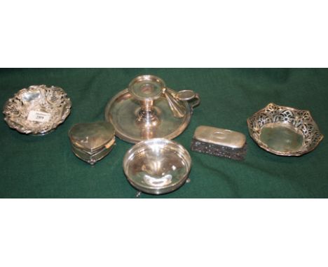 A LATE VICTORIAN SILVER SWEET MEAT DISH with pressed and pierced scroll and foliate decoration and standing on a turned stepp