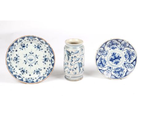 AN 18TH CENTURY ITALIAN BLUE AND WHITE ALBARELLO painted with flowering and leafy foliage, 21cms high; an 18th century Dutch 