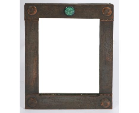 AN ARTS AND CRAFTS LOOKING GLASS with beaten copper rectangular frame with applied ceramic cabochon mount, 53 x 41.5cm