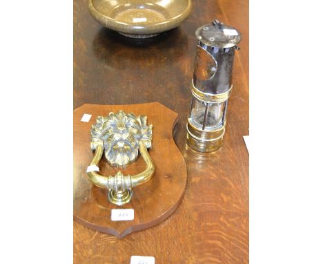 A brass lions head door knocker ; a Hailwood and Ackroyd Ltd. miners lamp converted to electric