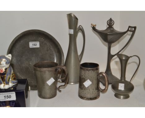 Pewter - an Arts and Crafts style pewter oil lamp, a pewter charger, , tankard; etc (6)