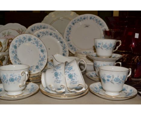 A Colclough Braganza pattern part tea and dinner service, decorated with blue floral sprigs