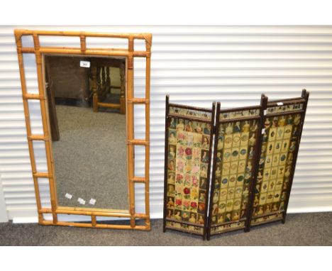 A bamboo framed wall mirror 95cm x 54 cm; a firescreen with decoupage tea cards (2)
