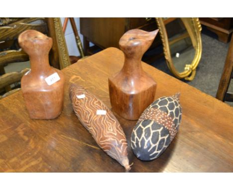 Tribal art - an African rain dance shaker;  another;  a pair of treen candlesticks (4)
