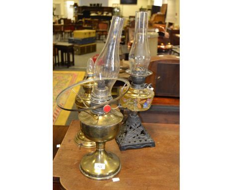 A Victorian oil lamp, cast iron conical base, c.1870;  others (3)