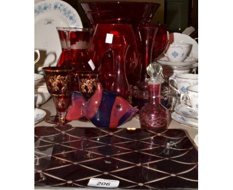 Glassware - a large ruby glass vase, a ruby glass penguin, cranberry glass perfume bottle and stopper,a Bohemian ruby glass g