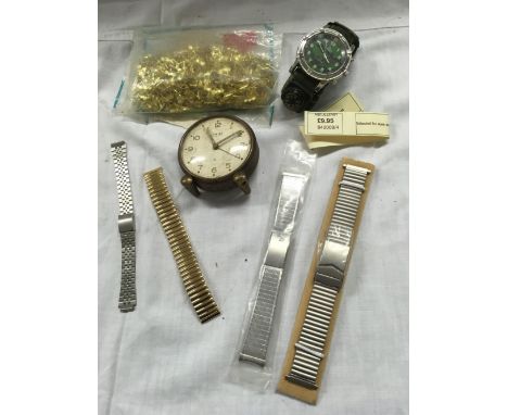 TUB WITH VARIOUS EXPANDING WATCH STRAPS, PACKET OF GOLD COLOURED CLIPS, A SWIZA DRESSING TABLE CLOCK &amp; A WATCH MARKED U.S