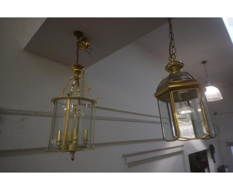 A 19thc style brass hanging lantern, 61cm x 28cm, together with a small brass hexagonal lantern (2)