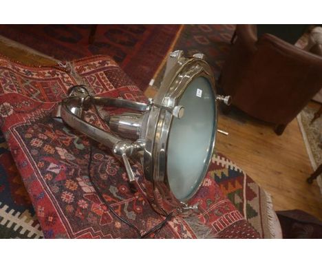 A large white metal theatre style lantern, the horse shoe bracket supporting a circular lantern, 55cm x 53cm