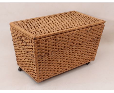 A mid-20th century rattan toy or doll basket - of tapered rectangular form, lined with pink silk, with a removable wicker tra