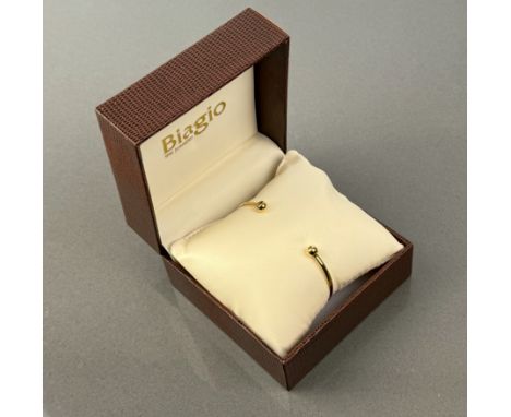 A 9ct gold bangle, a pair of 9ct gold pearl earrings, and a heart-shaped stick pin set with mother of pearl (possibly gold).