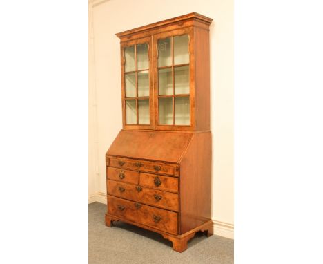 A burr walnut bureau-bookcase in&nbsp;George I style - the bureau earlier, later veneered and converted in the early 20th cen