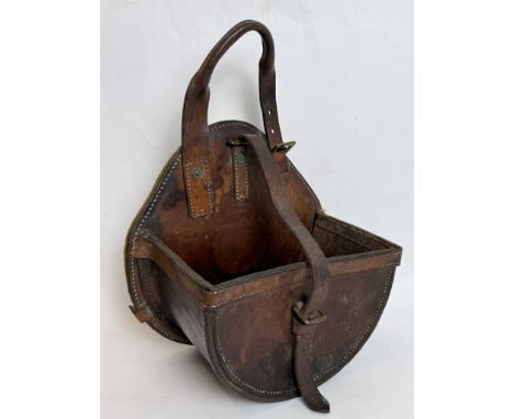 A 1934 leather military cartridge sling, saddle bag or pannier - stamped 'SSE NORRIS &amp; CO 1934 LIMITED', in thick-gauge d