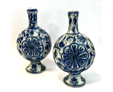 A pair of Iznik earthenware vases of pilgrim flask form - probably 19th century, the lobed bodies with central eight petalled