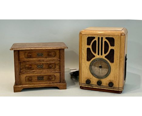 Two pieces, comprising - 1. An oak miniature apprentice piece chest of drawers - early 20th century, the moulded top over thr