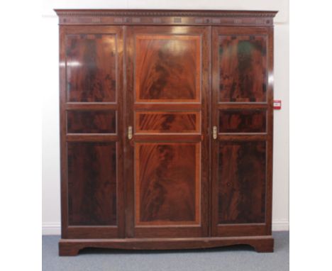 A 1920s mahogany triple wardrobe in the Georgian style - by Robson &amp; Sons Ltd of Newcastle Upon Tyne (maker's label insid