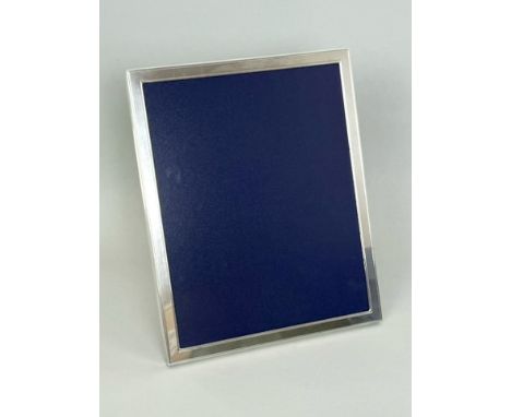 An Elizabeth II silver photo frame by Asprey of London - 2007, plain rectangular form with line engraved borders, wooden ease