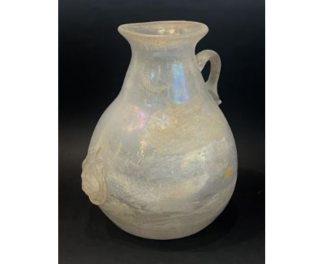 A large Roman style glass pitcher &ndash; probably early 20th century, in opaque clear glass with an iridescent surface, of p