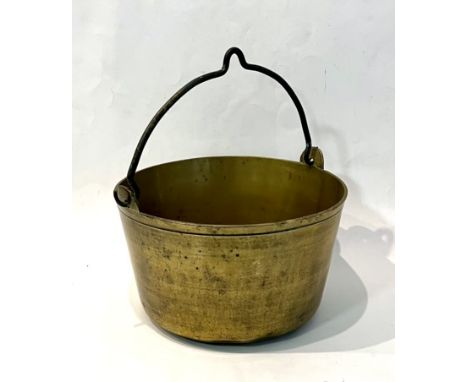 An antique brass jam or preserve pan - with iron swing handle, 29.25cm diameter.