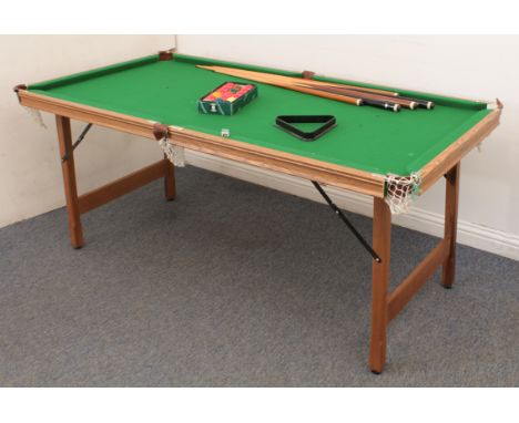 A 6 x 3ft Riley snooker table - with folding wooden legs and light oak effect frame, in good condition, with five cues, a box