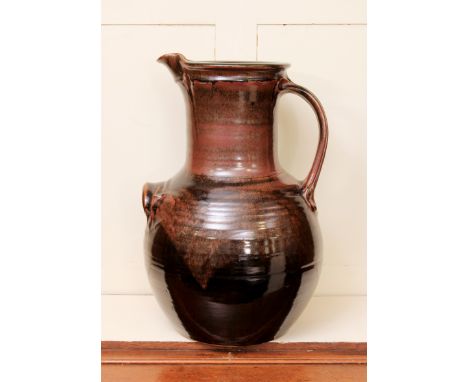 **Michael (Mick) Casson, OBE (British, 1925-2003): a very large studio pottery stoneware jug - of baluster form with a moulde