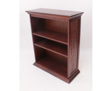 A reproduction mahogany open bookcase - with stained rattan sides and two adjustable shelves (LWH 75 x 30 x 90.5cm); together